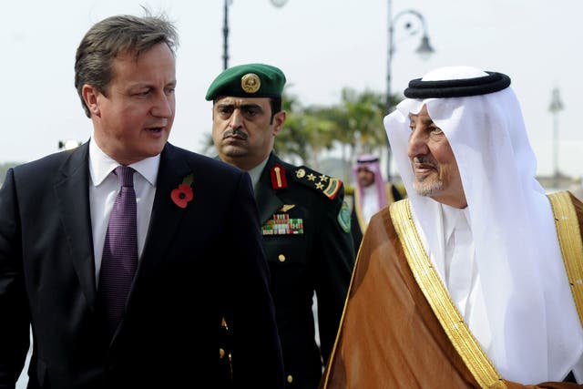 Prince Khalid bin Faisal bin Abdulaziz, right, with British Prime Minister David Cameron
