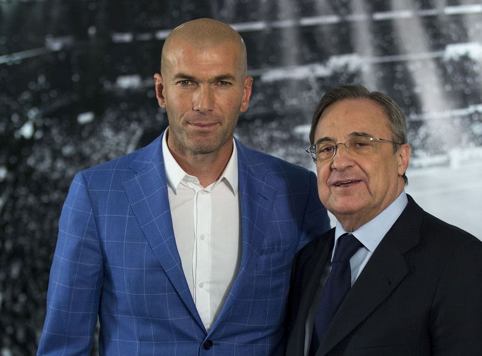 Real Madrid CF president Florentino Perez, right, poses for a picture with Zinedine Zidane, left, as new Real Madrid head coach at Santiago Bernabeu Stadium