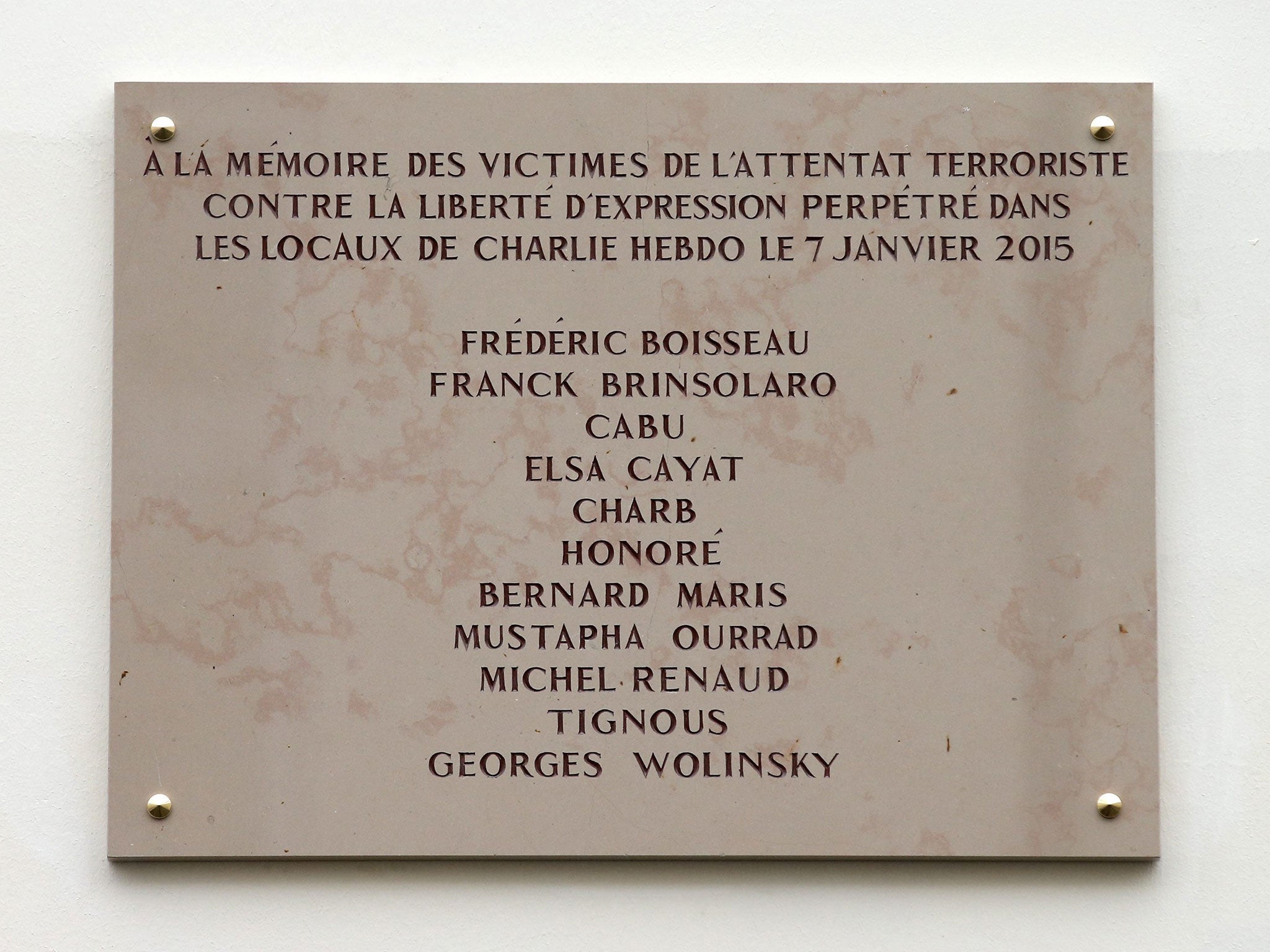 A commemorative plaque to pay tribute to the victims of 2015's attacks outside the former offices of French weekly satirical newspaper Charlie Hebdo