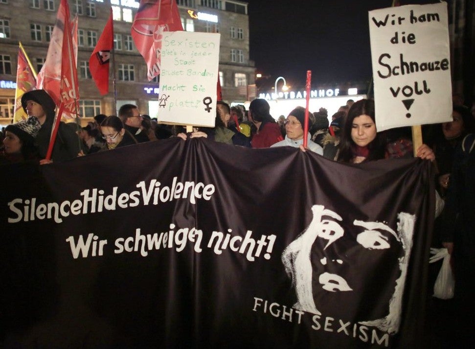 Women protest against sexism outside Cologne Cathedral on 5 January after the assaults