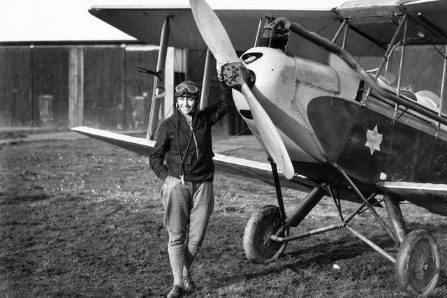 English aviator Amy Johnson standing in front of her Gipsy Moth just before she undertook a 19-day solo flight to Australia. She died in 1941 when an aircraft she was ferrying crashed into the Thames estuary.