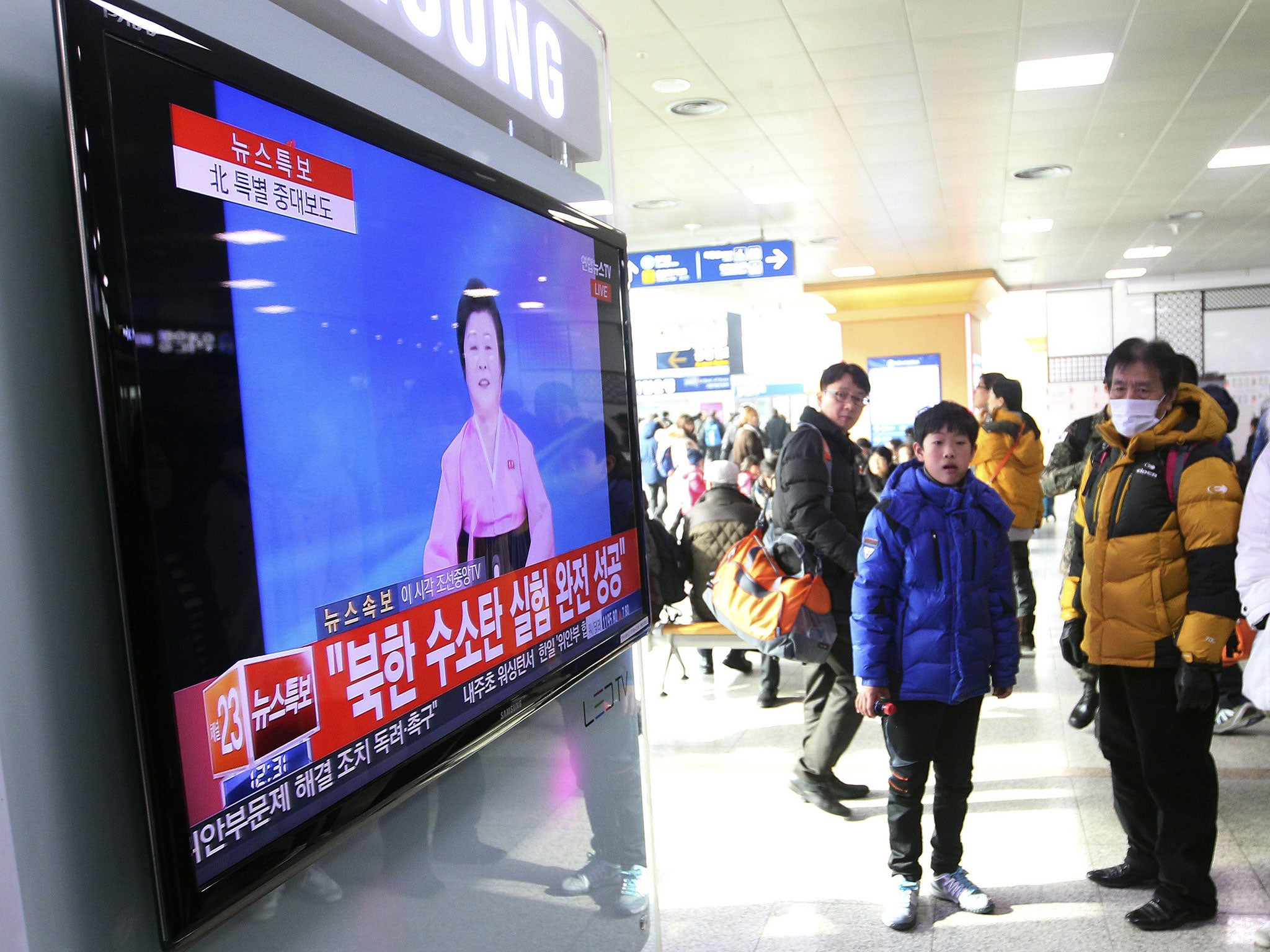 People in Seoul watch the announcement on South Korean television