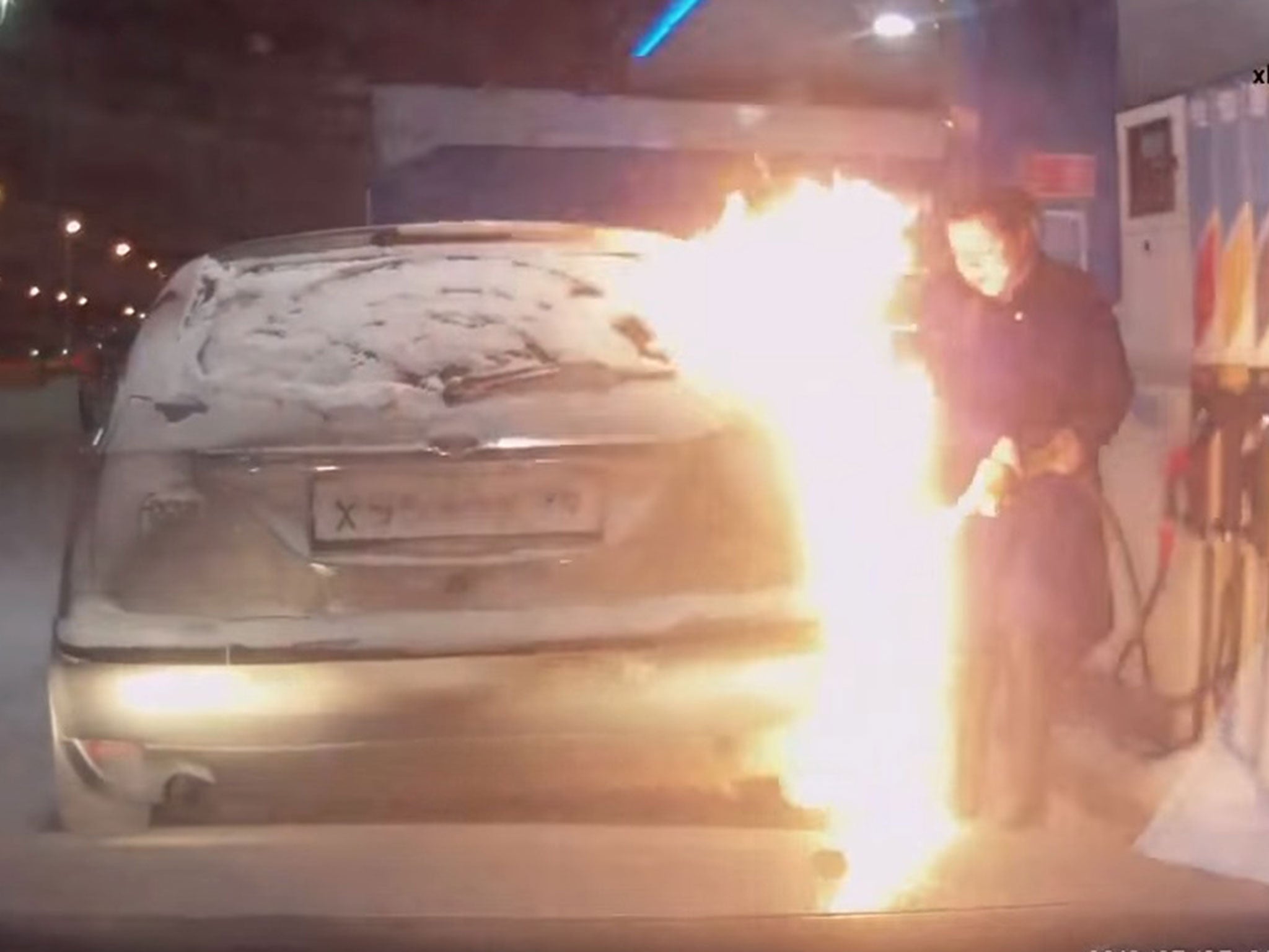 Flames soon lick up the car's exterior and spread