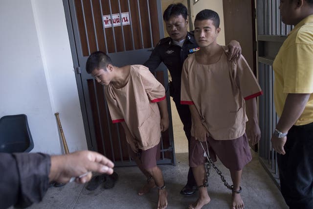 Zaw Lin and Wai Phyo are escorted out of the court after being sentenced to death on Christmas Eve 2015