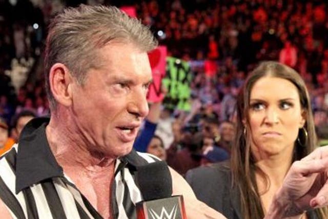 Vince McMahon delivers the news to WWE champion Roman Reigns