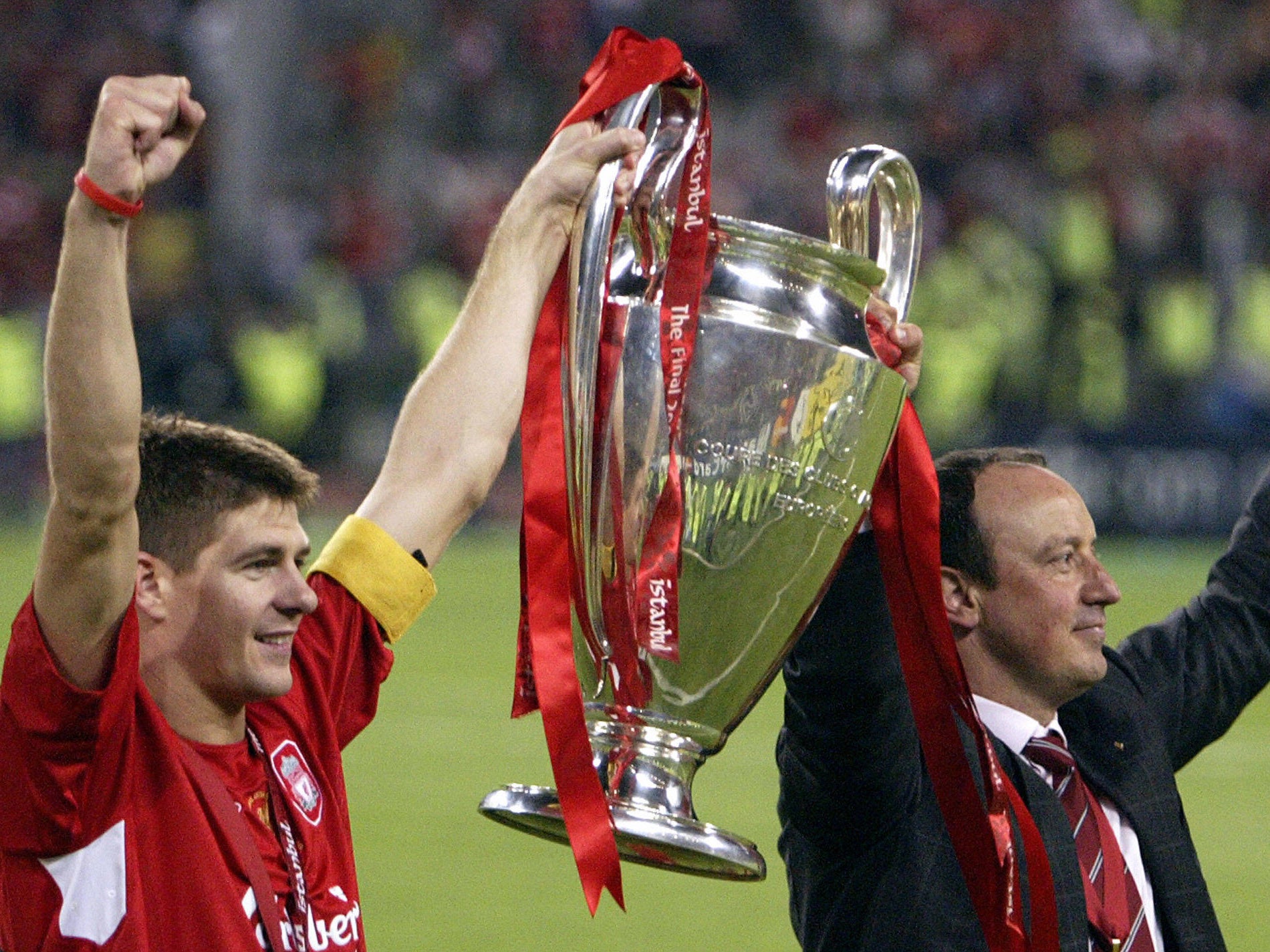 Steven Gerrard and Rafa Benitez hold the Champions League trophy aloft following their triumphant success in 2005