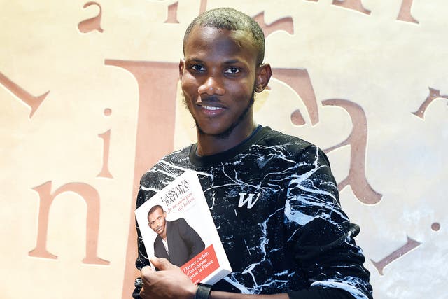Lassana Bathily with his book ‘Je ne suis pas un heros’  (‘I