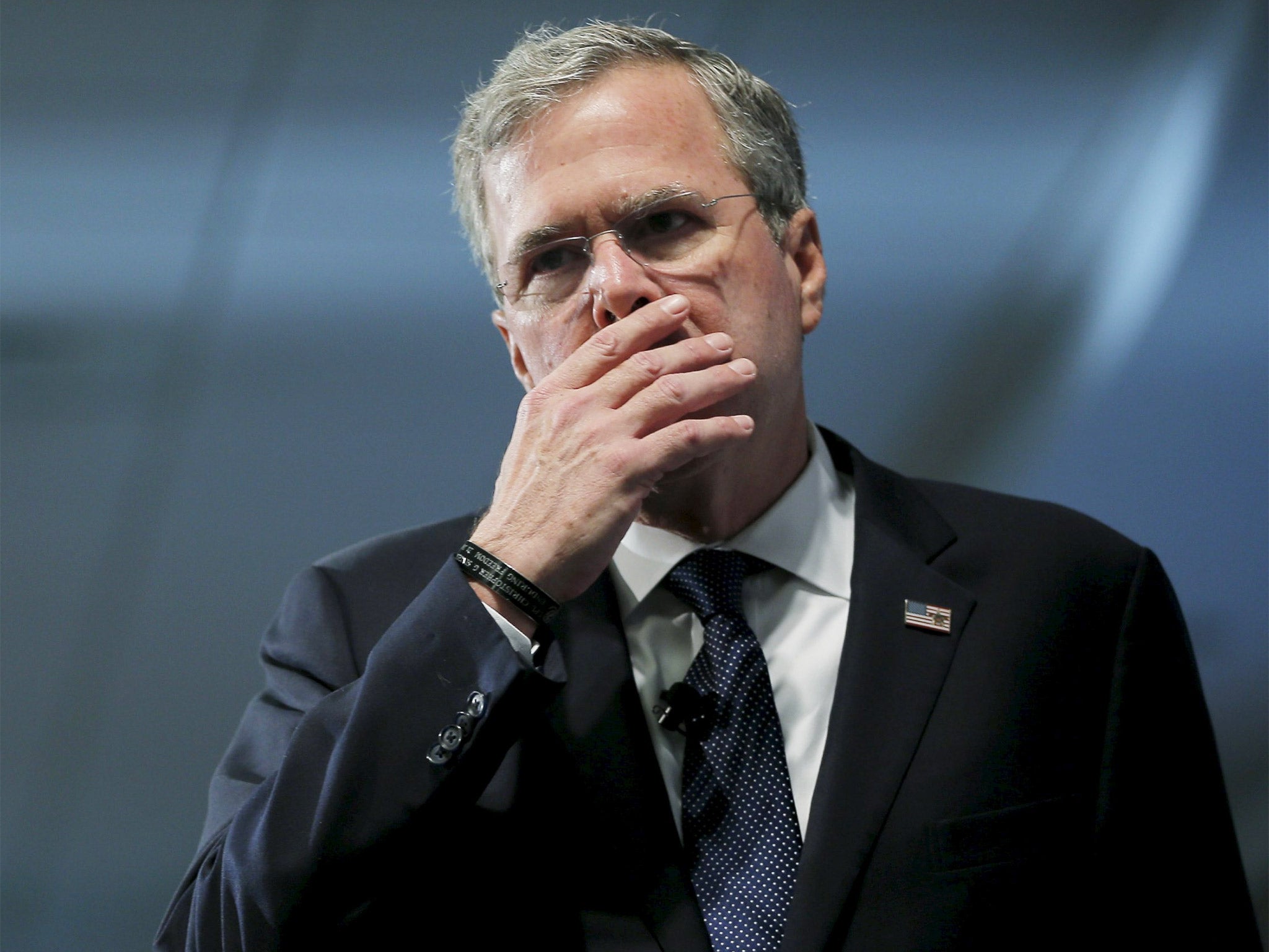 Jeb Bush pauses while speaking about his daughter at the New Hampshire forum on drug addiction