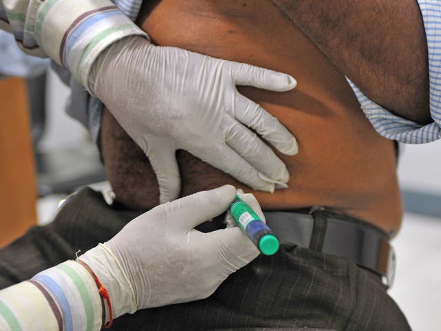 An insulin shot is administered to a diabetes patient