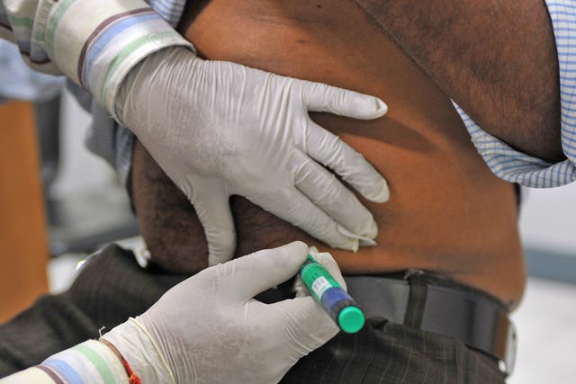 An insulin shot is administered to a diabetes patient