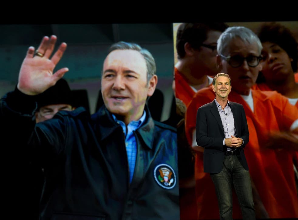 Netflix CEO Reed Hastings delivers a keynote address in front of an image of actor Kevin Spacey from 'House of Cards' and an image from the show 'Orange is the New Black' at CES 2016 at The Venetian Las Vegas on January 6, 2016 in Las Vegas, Nevada