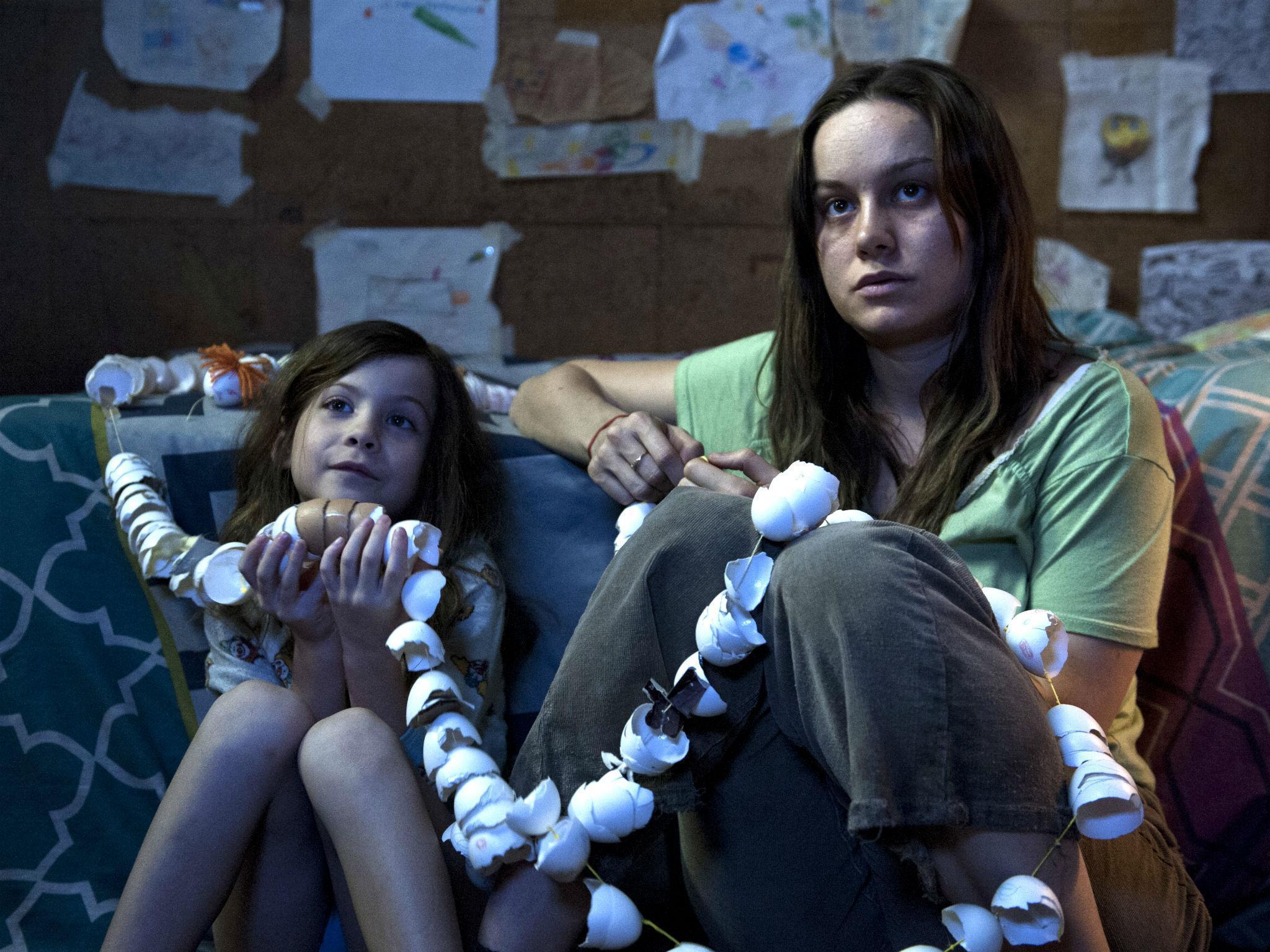 Jacob Tremblay and Brie Larson making a chain out of eggshells in Room