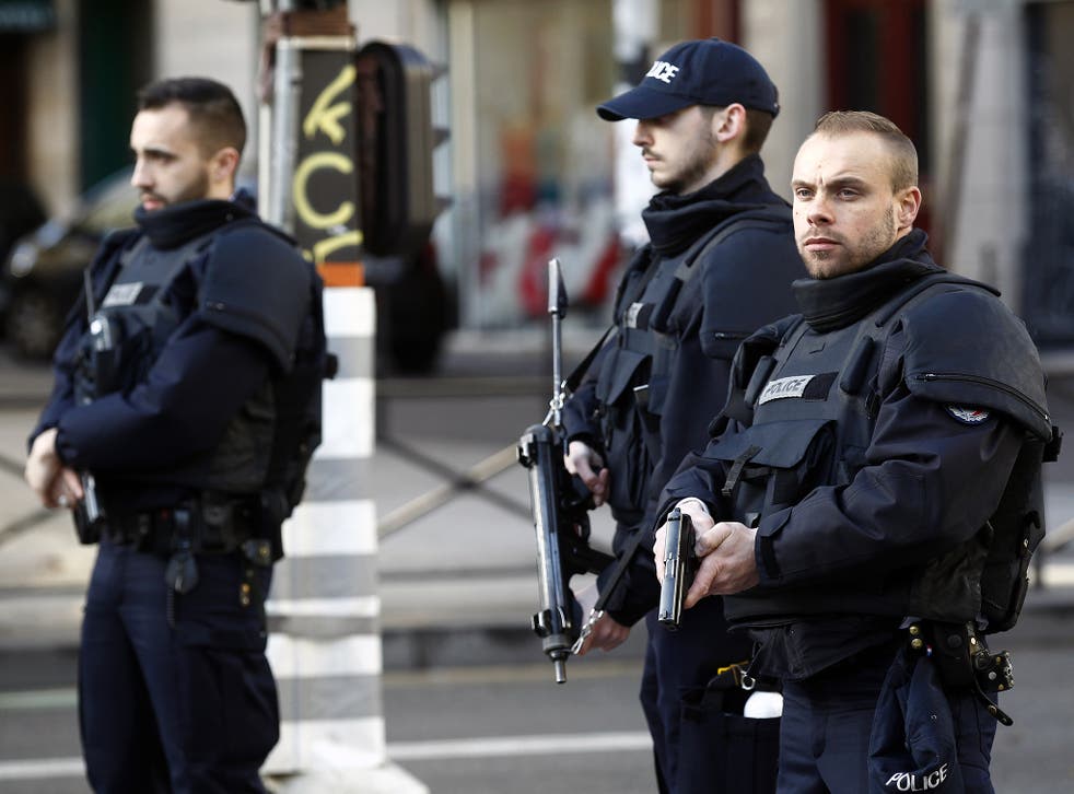 Armed French police patrol near the Boulevard de Barbes in the north of Paris
