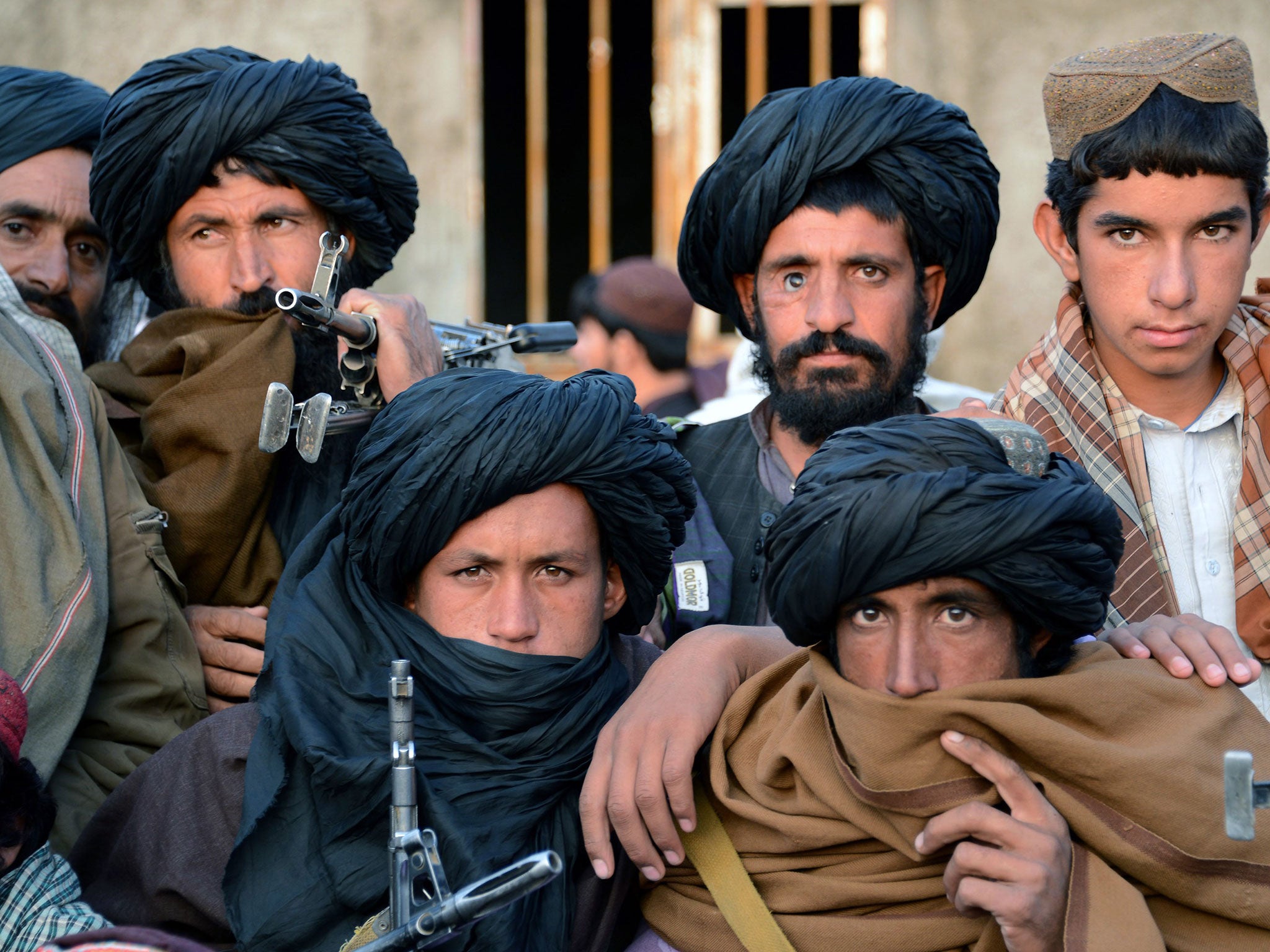 Afghan fighters belonging to a breakaway faction of the Taliban gather at Bakwah in the western province of Farah in November; China wants the rift healed so it can work with the group