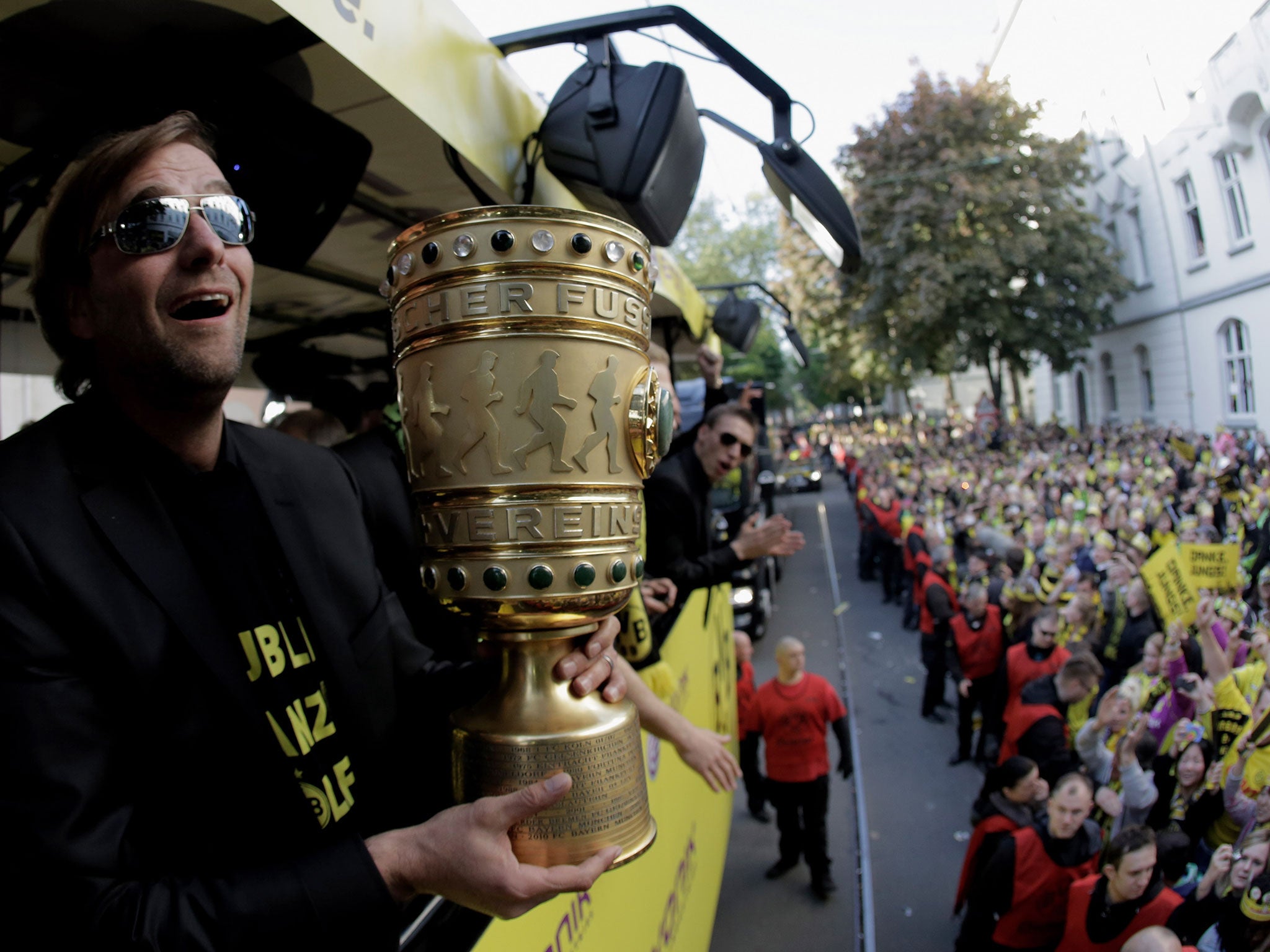 Jürgen Klopp, then Borussia Dortmund coach, during a victory parade on an open-top bus after winning the DFB Pokal – Germany’s equivalent of the FA Cup – in 2012