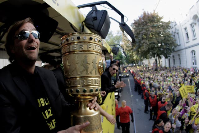 Jürgen Klopp, then Borussia Dortmund coach, during a victory parade on an open-top bus after winning the DFB Pokal – Germany’s equivalent of the FA Cup – in 2012
