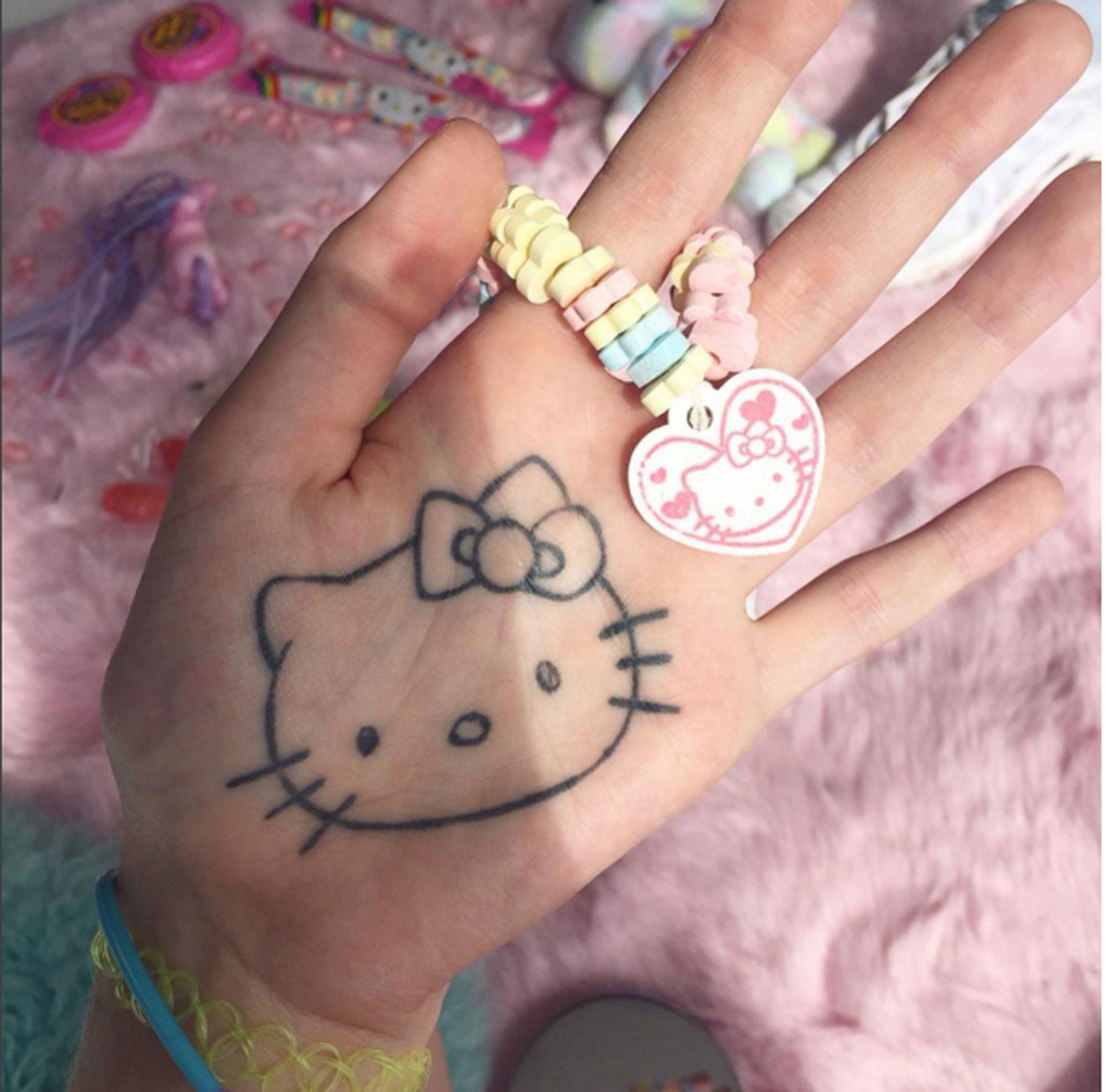 Barker says: ‘I wanted to get a tattoo on the palm of my hand and because it was painful I was like, 'what do I believe in enough to get tattooed on my hand for the rest of my life?', and I was like – Hello Kitty’