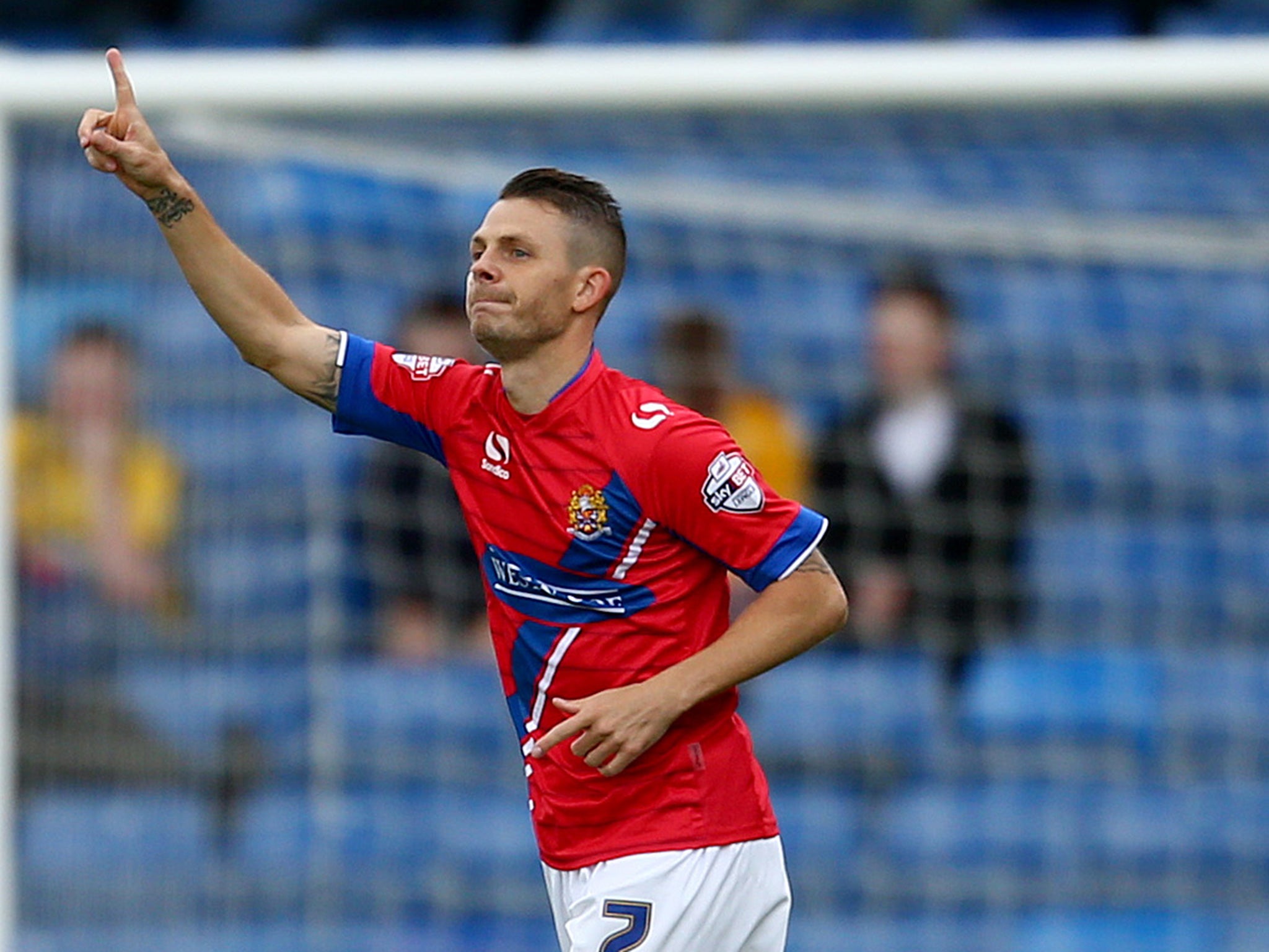 Jamie Cureton celebrates another goal for the Daggers earlier this season