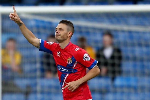 Jamie Cureton celebrates another goal for the Daggers earlier this season