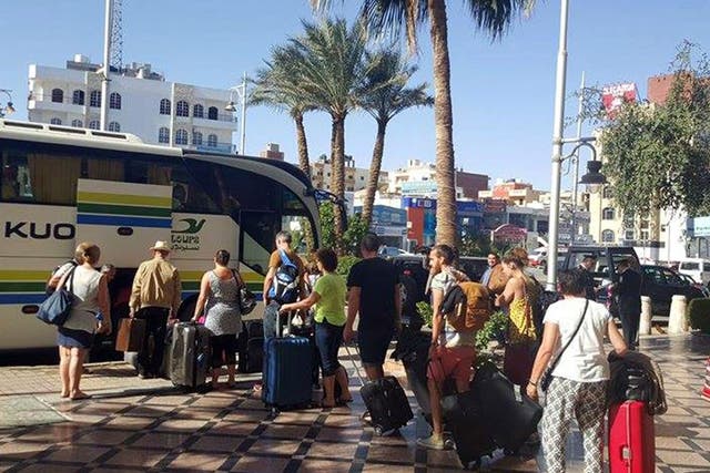 Tourists leave the Bella Vista Hotel following the attack