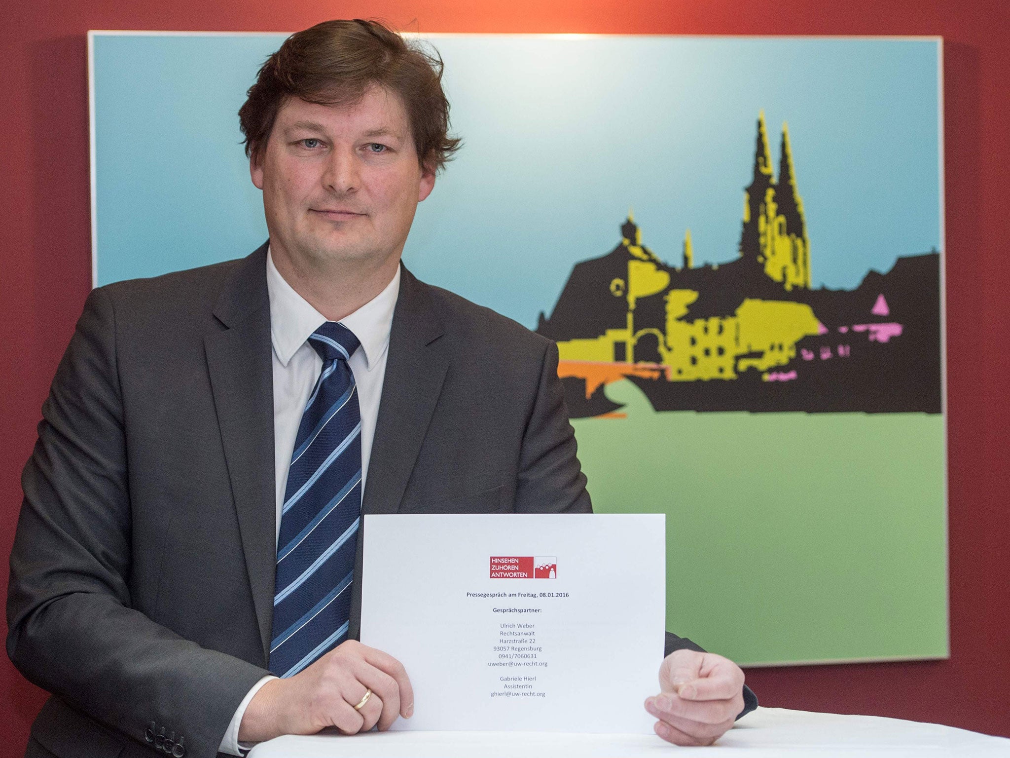 Lawyer Ulrich Weber presents his report in Regensburg, southern Germany, on January 8, 2016.