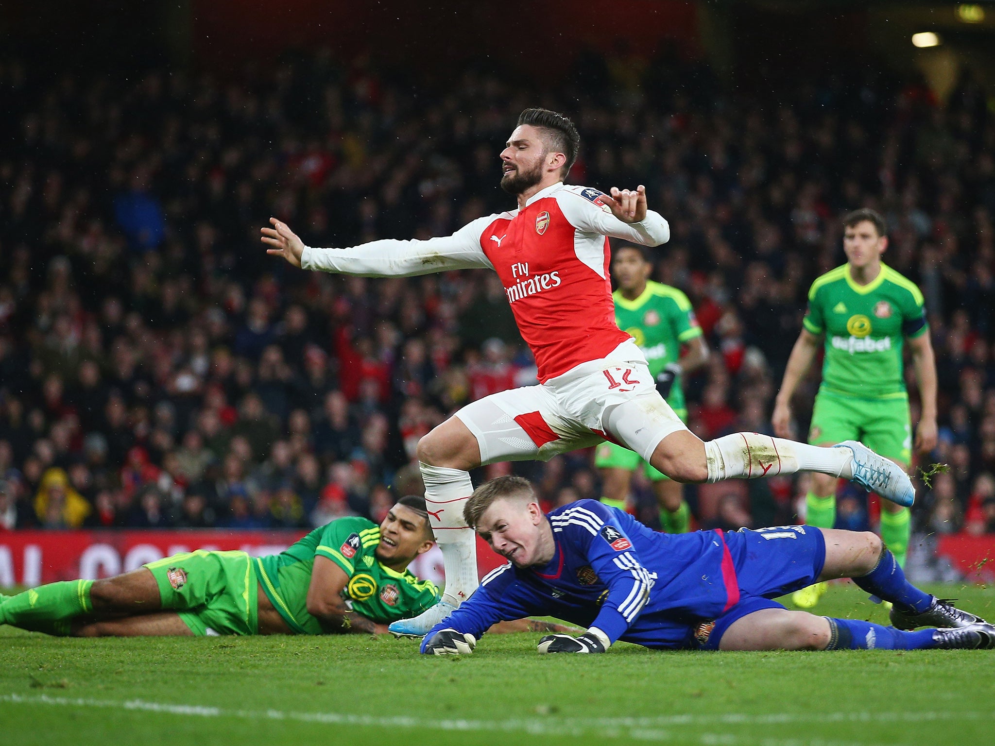 Olivier Giroud pounces to tap in the third