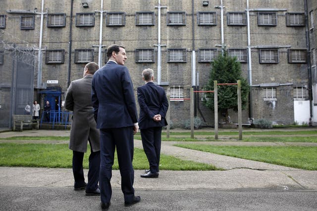 Michael Gove, right, and George Osborne, centre, toured Brixton Prison last year