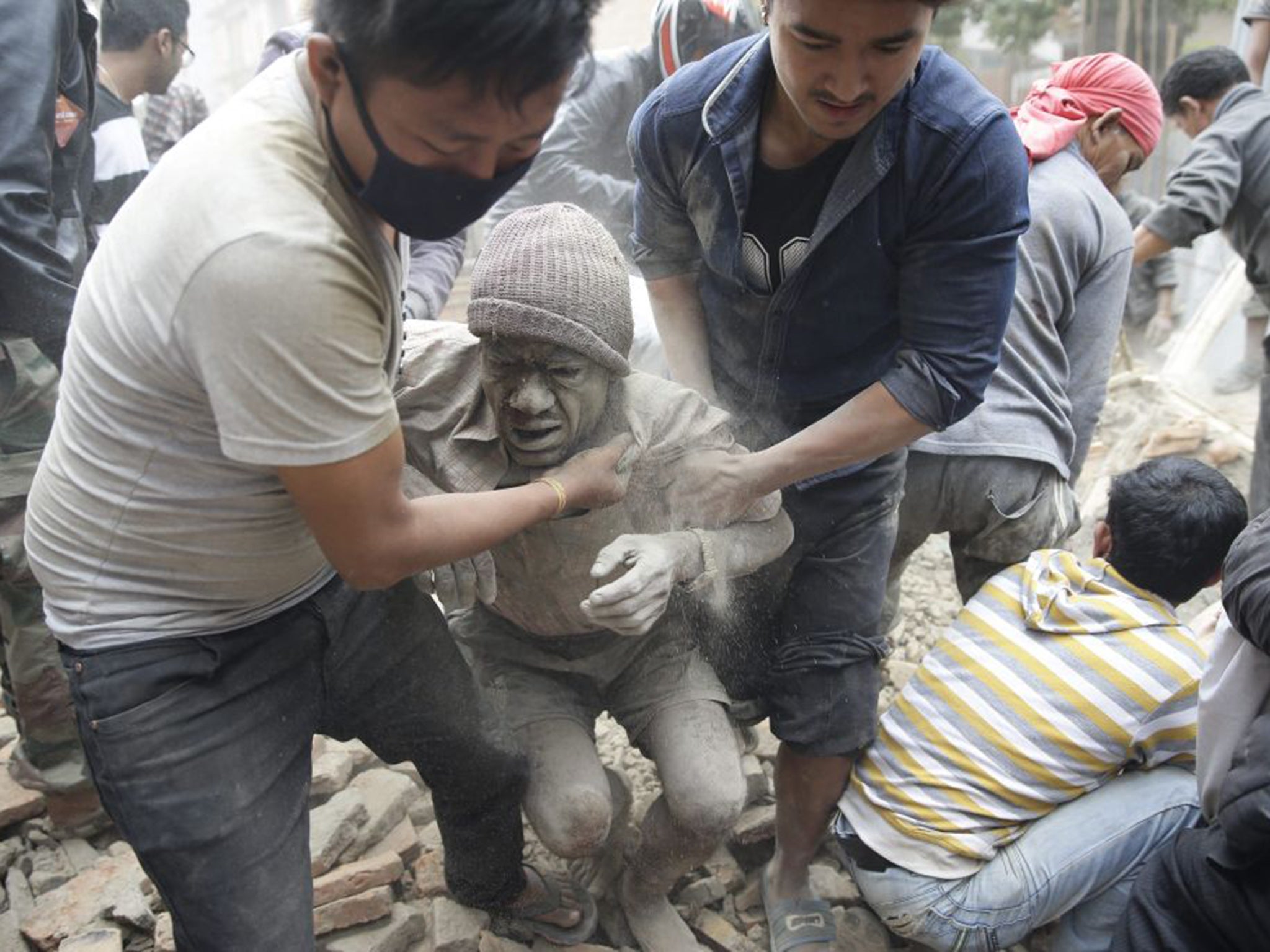 A man is freed from the rubble in the Kathmandu earthquake last year