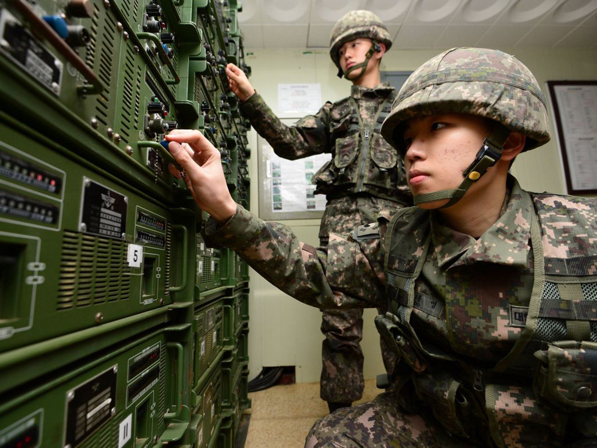 South Korean soldiers operate the speakers while on border patrol