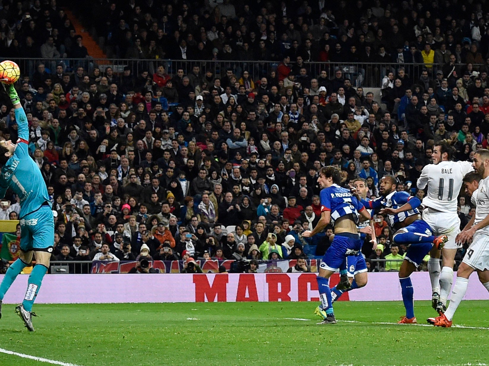 Gareth Bale leaps above the Deportivo defence to score for Madrid