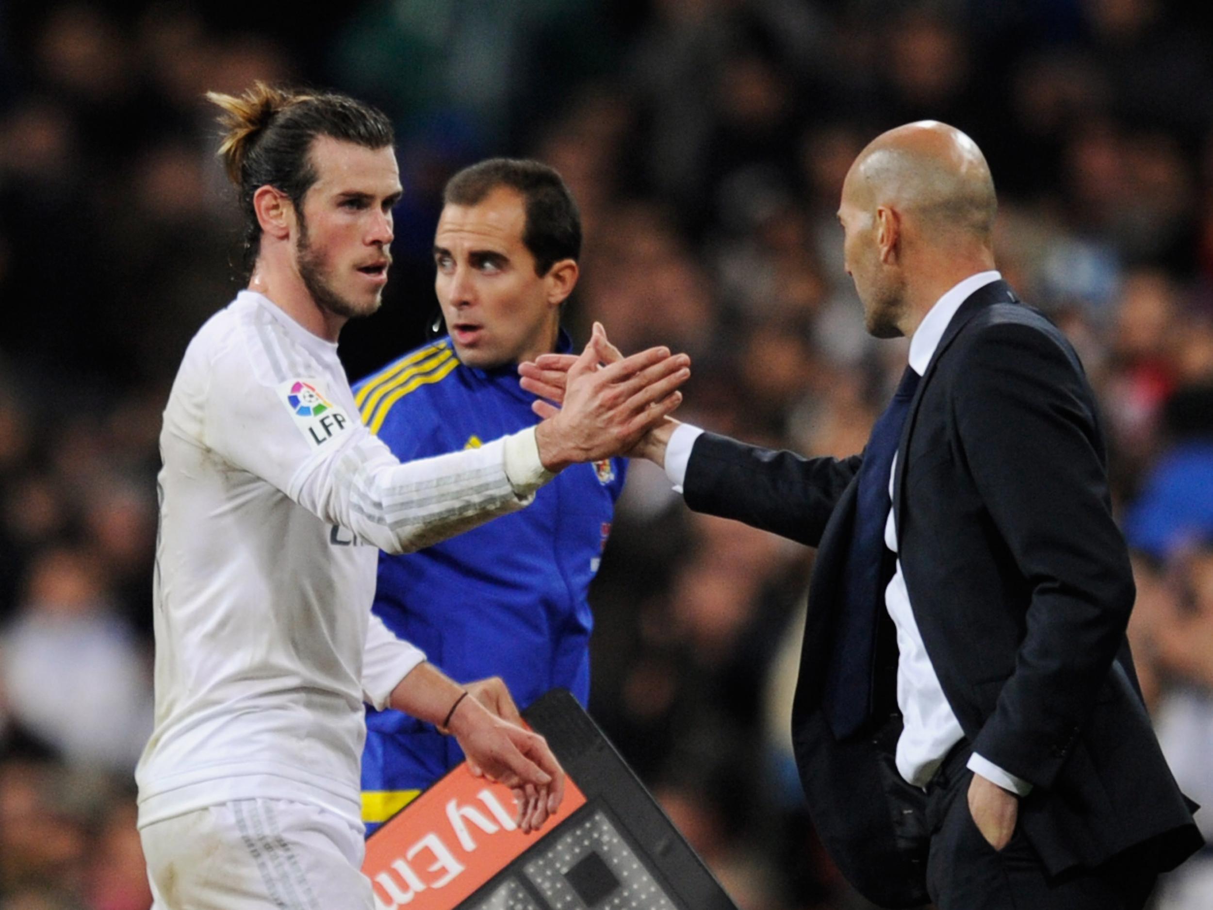 Gareth Bale greets Real Madrid manager Zinedine Zidane after scoring a hat-trick in the Frenchman's first match in charge
