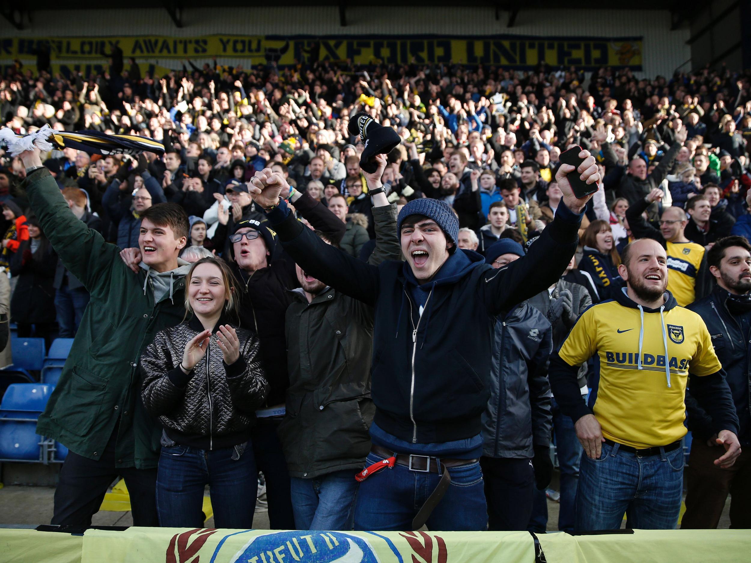 Oxford fans celebrate the victory against Swansea