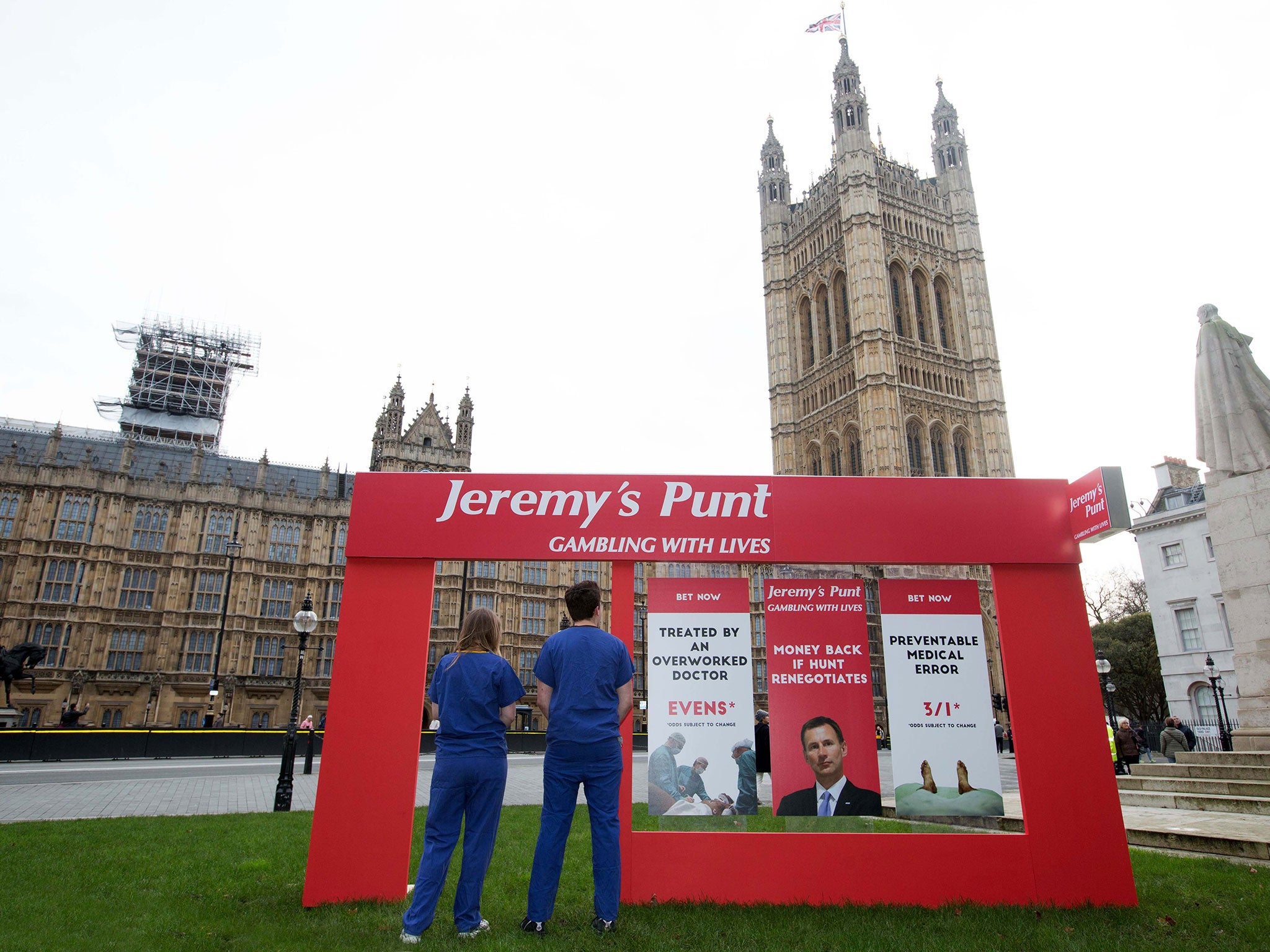 Campaigners for the junior doctors’ cause set up a fake betting shop frontage outside Parliament