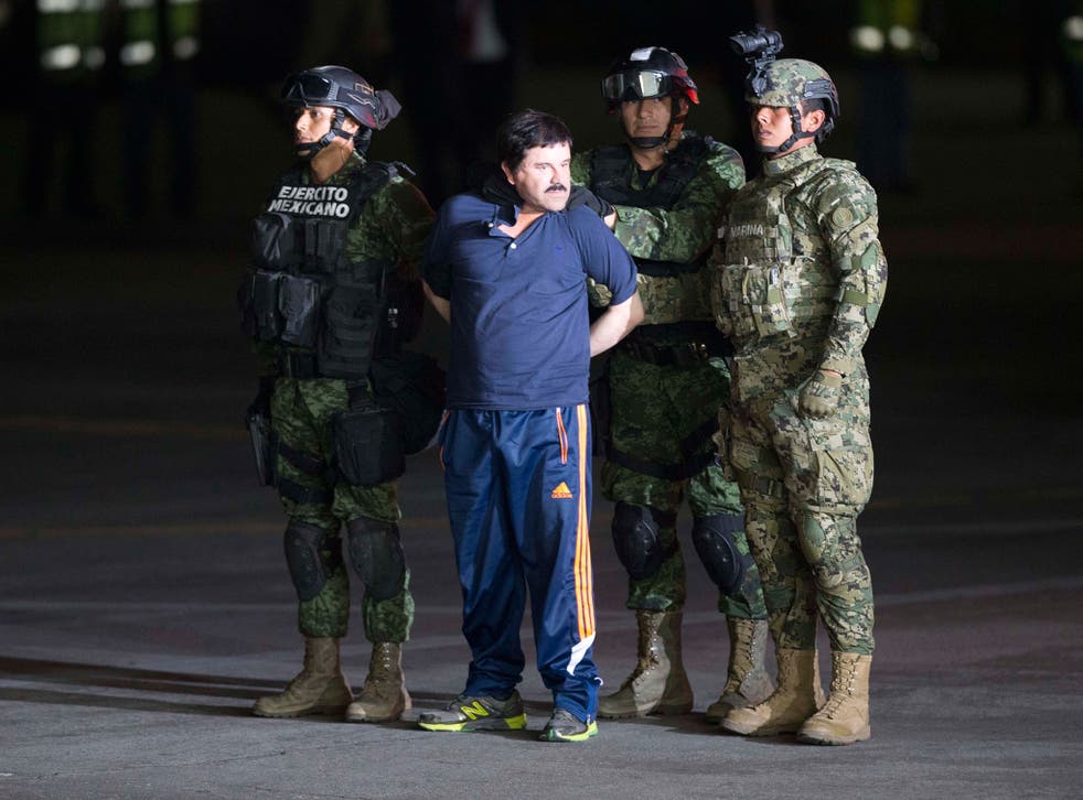 The Mexican drug lord Joaquin ‘El Chapo’ Guzman is escorted by soldiers and marines after his capture