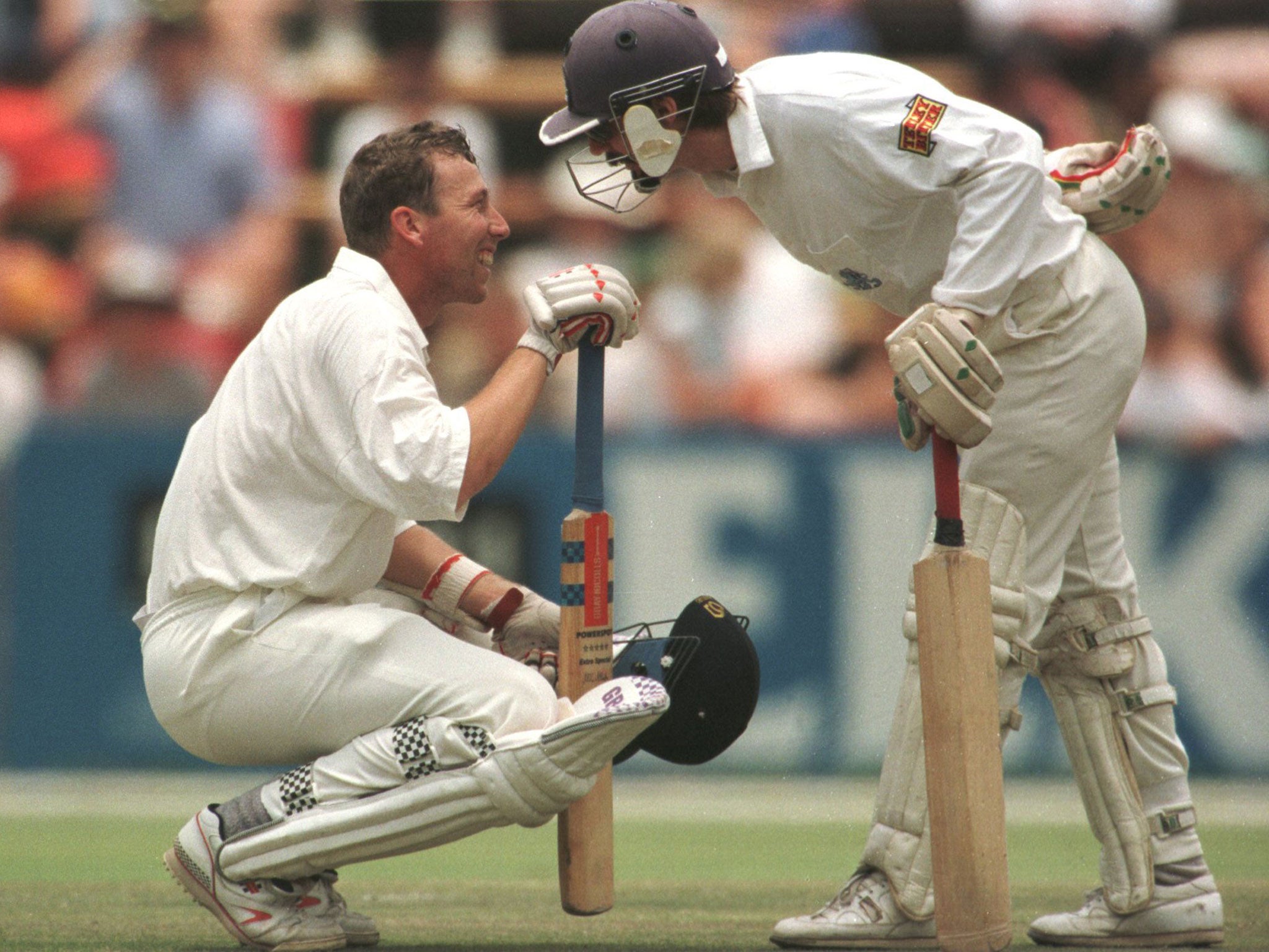 Atherton receives words of wisdom from batting partner Jack Russell after being hit by the ball at the same venue in 1995