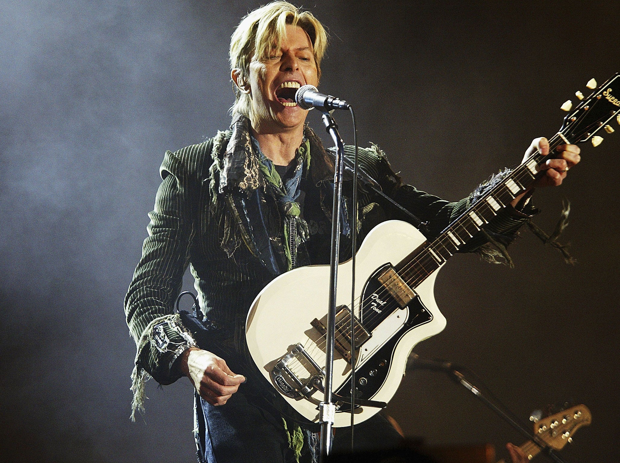 David Bowie performs on stage on the third and final day of 'The Nokia Isle of Wight Festival 2004' at Seaclose Park, on June 13, 2004 in Newport, UK