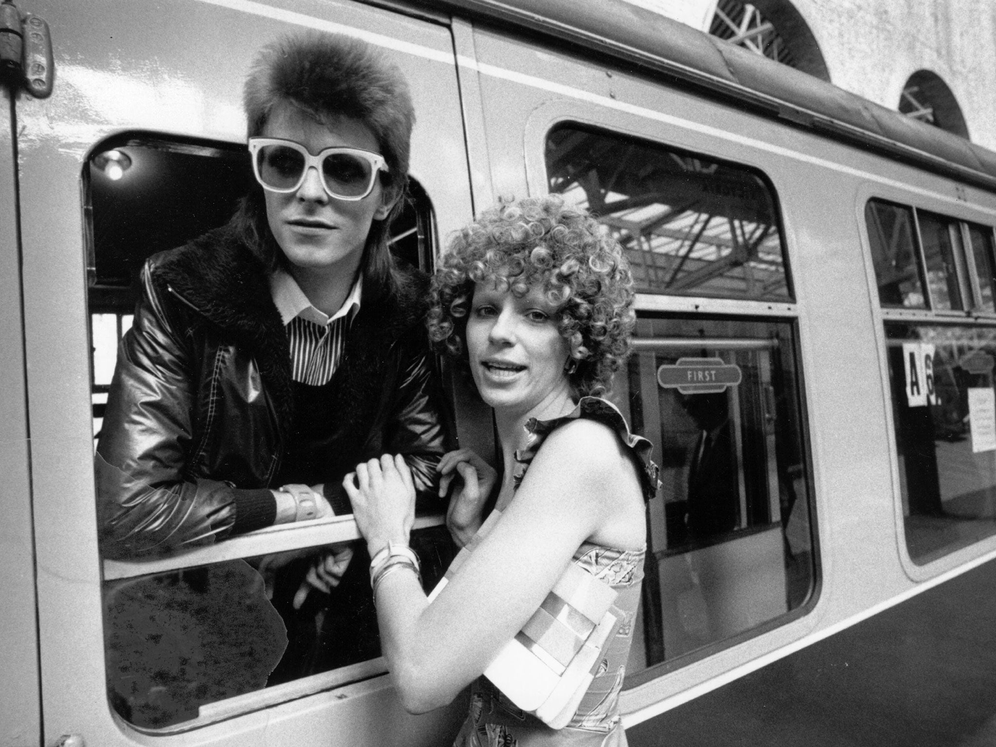 9 July 1973: Pop singer David Bowie is seen off at the station by his wife Angie