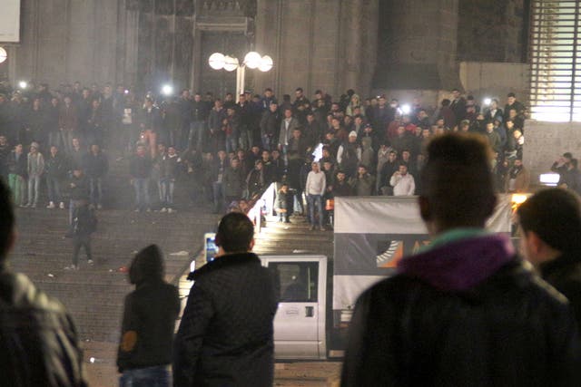 Picture taken on 31 December, 2015 shows people gathering in front of the main railway station in Cologne
