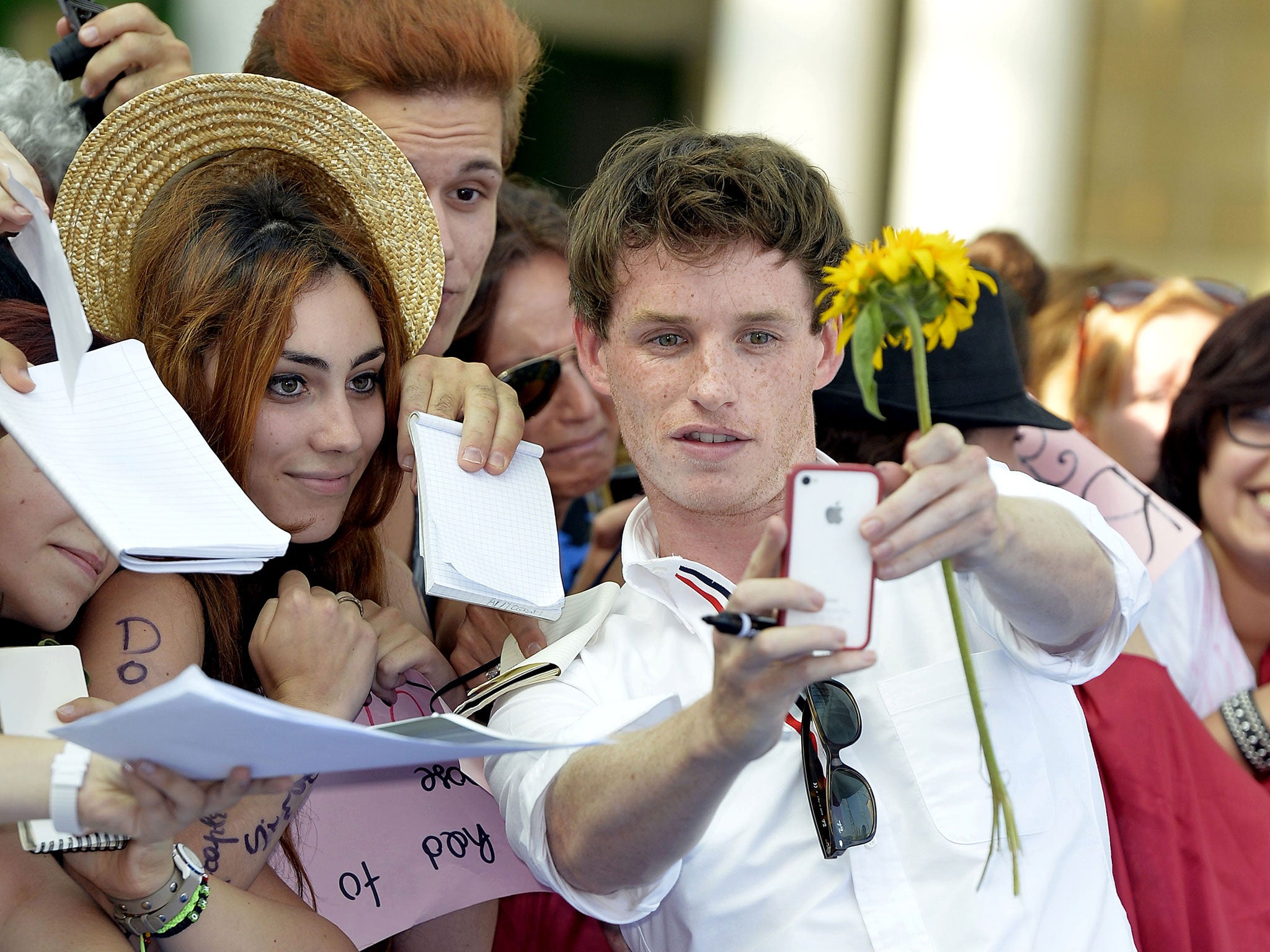Eddie Redmayne with fans at the Giffoni Film Festival, Italy in 2013. The actor tried to live without his iPhone as he felt it had become too great a distraction