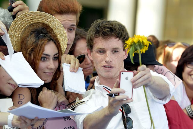Eddie Redmayne with fans at the Giffoni Film Festival, Italy in 2013. The actor tried to live without his iPhone as he felt it had become too great a distraction