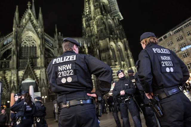 Police guard the area around the cathedral in Cologne after reports of attacks on men of North African or Arab appearance, in retaliation for the New Year’s Eve sex assaults