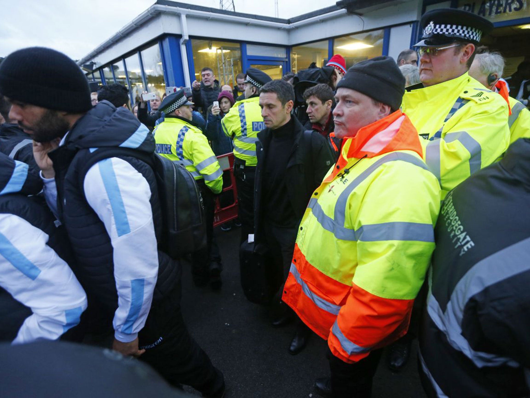 Rémi Garde is given a police escort away from Wycombe