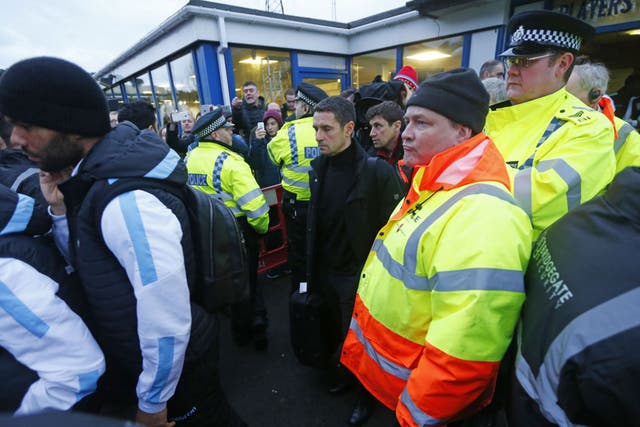 Rémi Garde is given a police escort away from Wycombe