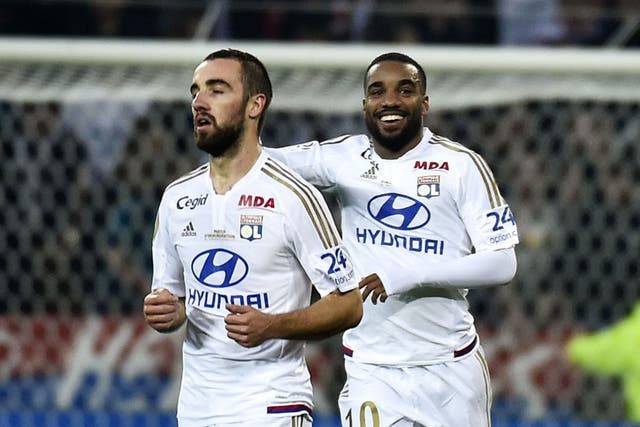 Alexandre Lacazette, right, has been strongly linked with a move from Lyon to Newcastle