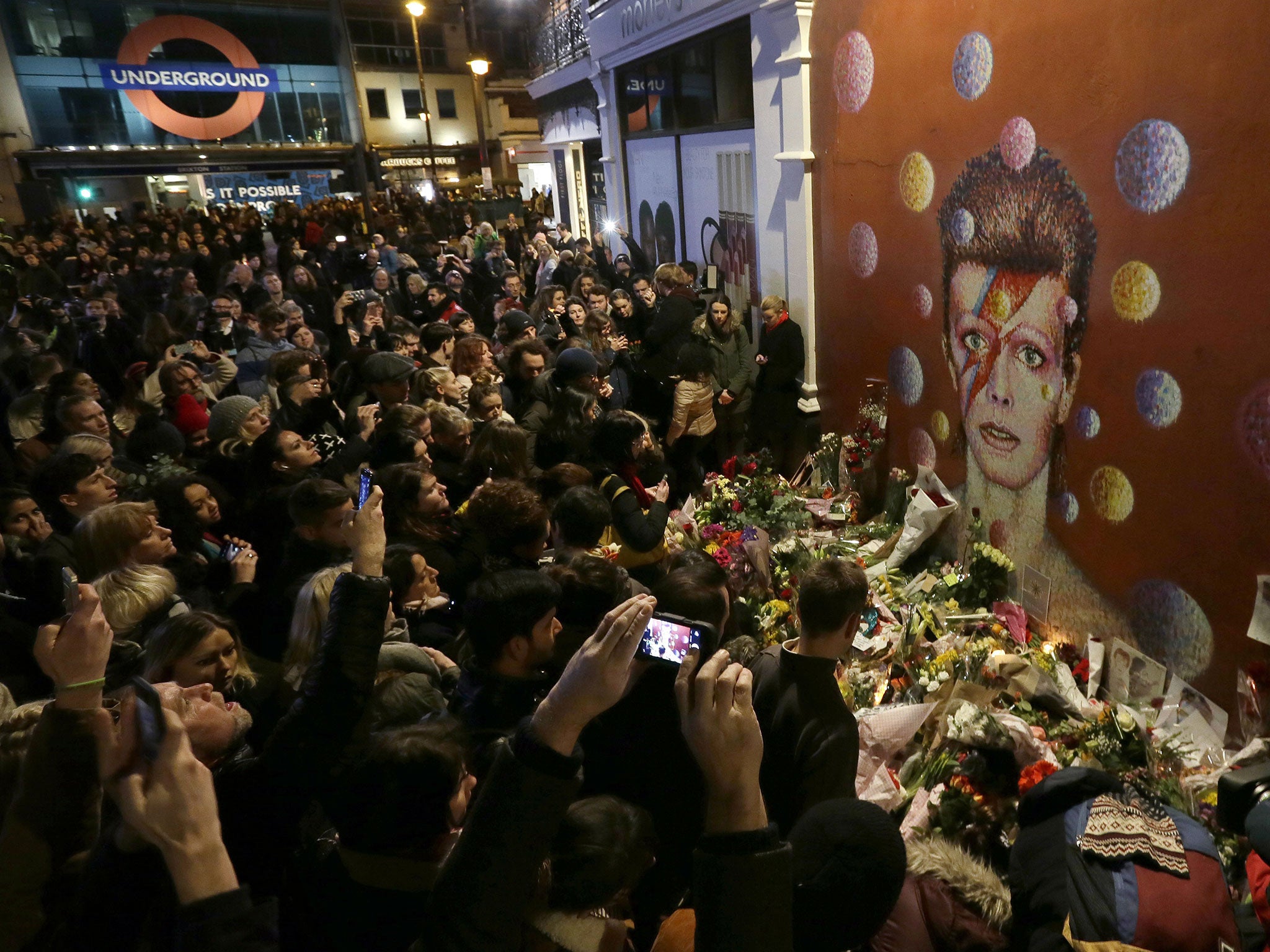 David Bowie fans gather in Brixton to pay tribute to the artist
