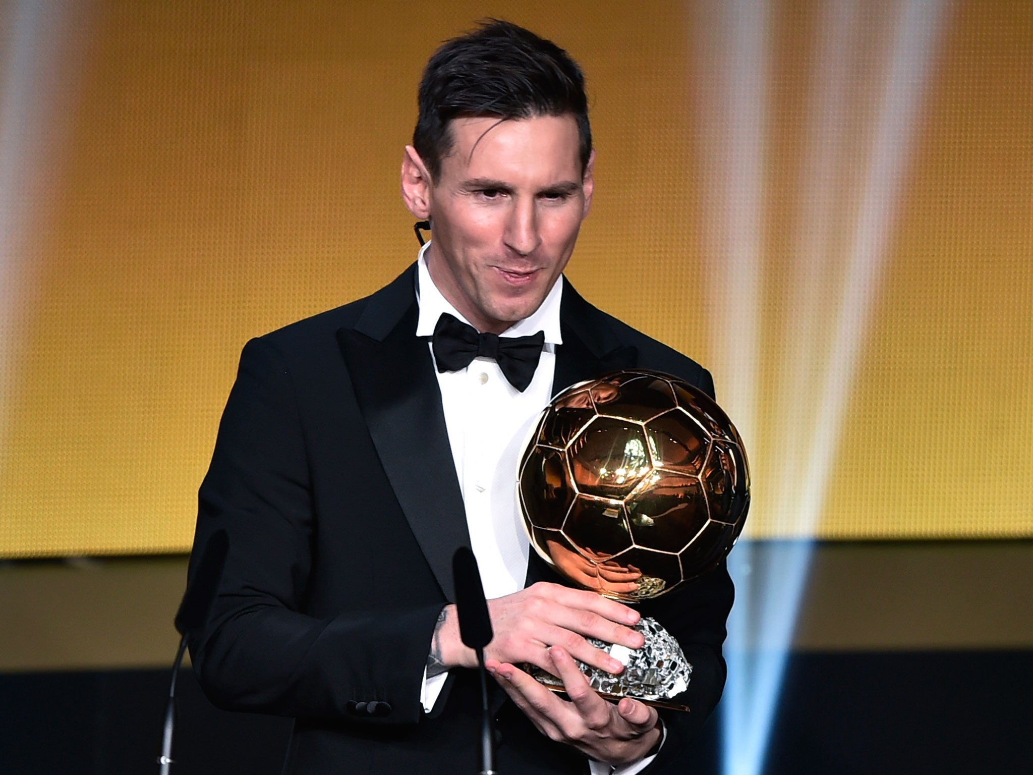 Barcelona forward Lionel Messi celebrates winning the 2015 Ballon d'Or