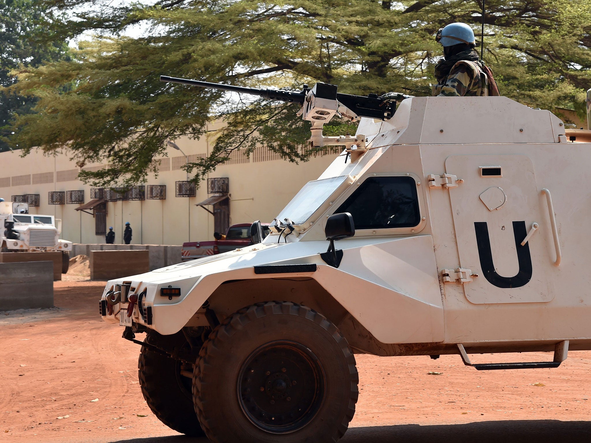 UN peacekeepers patrol outside a vote-counting centre for elections in Bangui