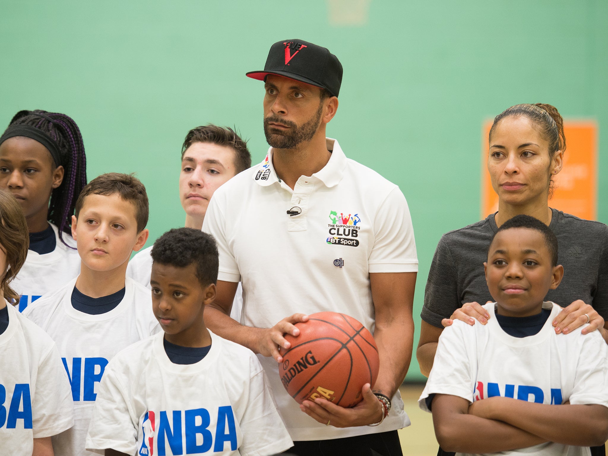 Ferdinand alongside former WNBA player Feaster and kids at the coaching session