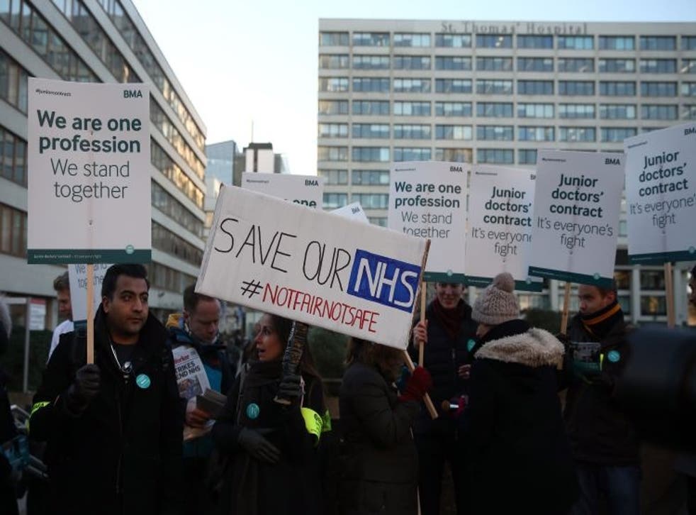 Members of staff take part in a picket outside St Thomas' Hospital on January 12, 2016 in London, United Kingdom.