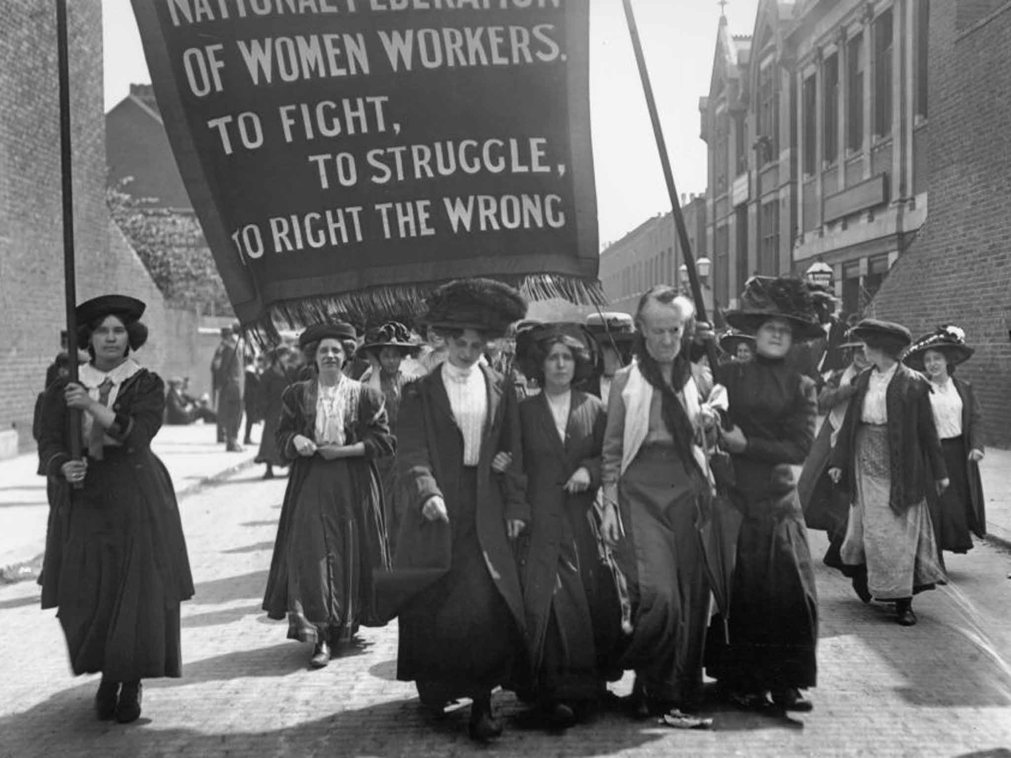 May 1911: British suffragette Charlotte Despard (1844 - 1939) (wearing a white waistcoat) heads a march of the National Federation of Women Workers through Bermondsey in South London